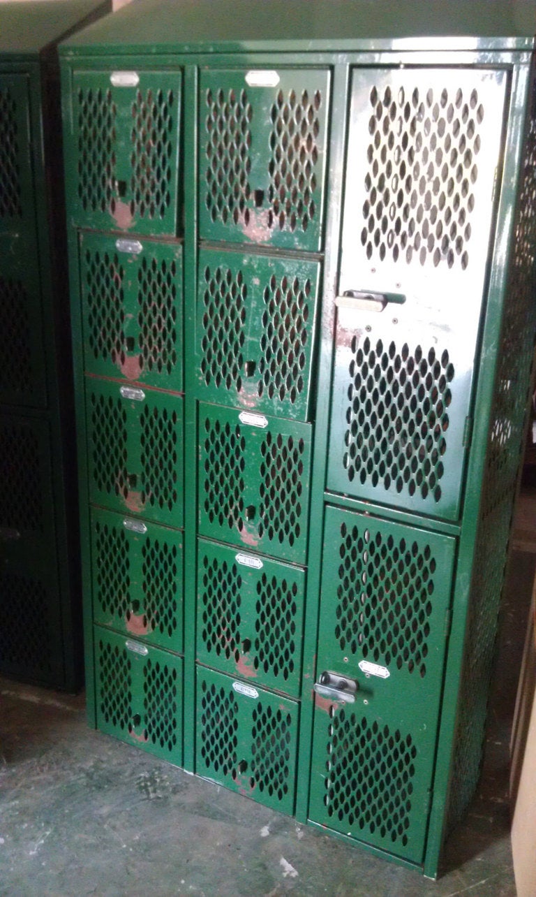 Painted steel gym locker offers a unique configuration of large and small compartments: 2 large lockers and 10 small lockers, each in fine working order. At 36