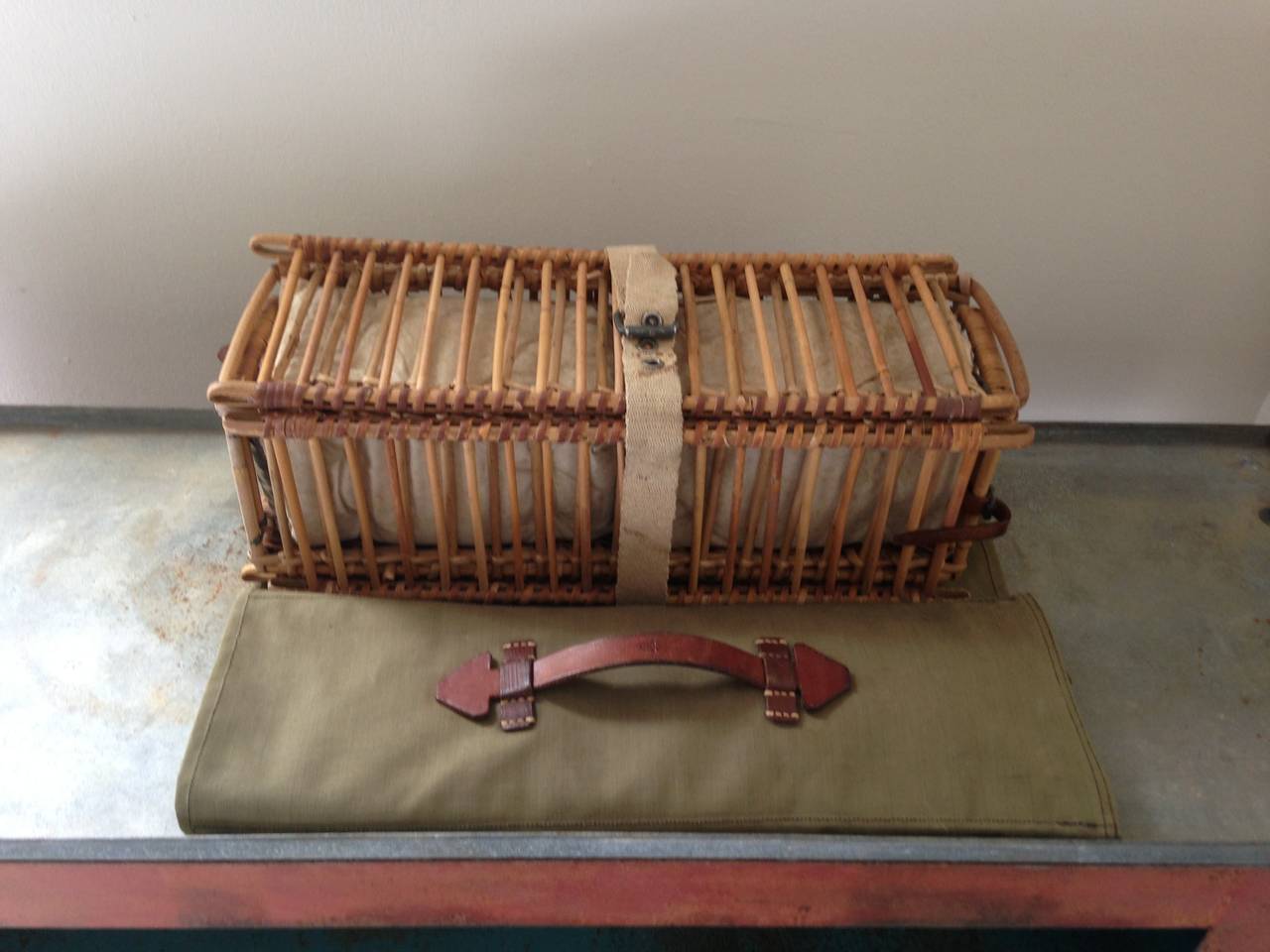 World War II messenger pigeon carrier for two pigeons. Complete with two comfy pigeon berths, portable exercise pen and canvas carrying case with leather handles and strapping. Rare piece of war memorabilia in excellent condition used to transport