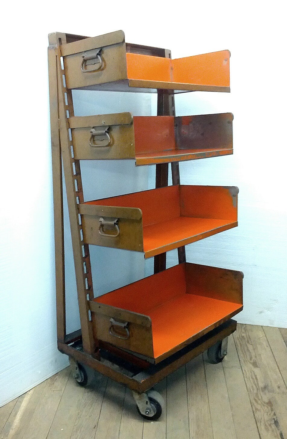 Straight from the factory - but clean and room ready - this early shelving unit add storage to any room. Can also be used as bookcase. Adjustable bins. Casters allow unit to move easily.