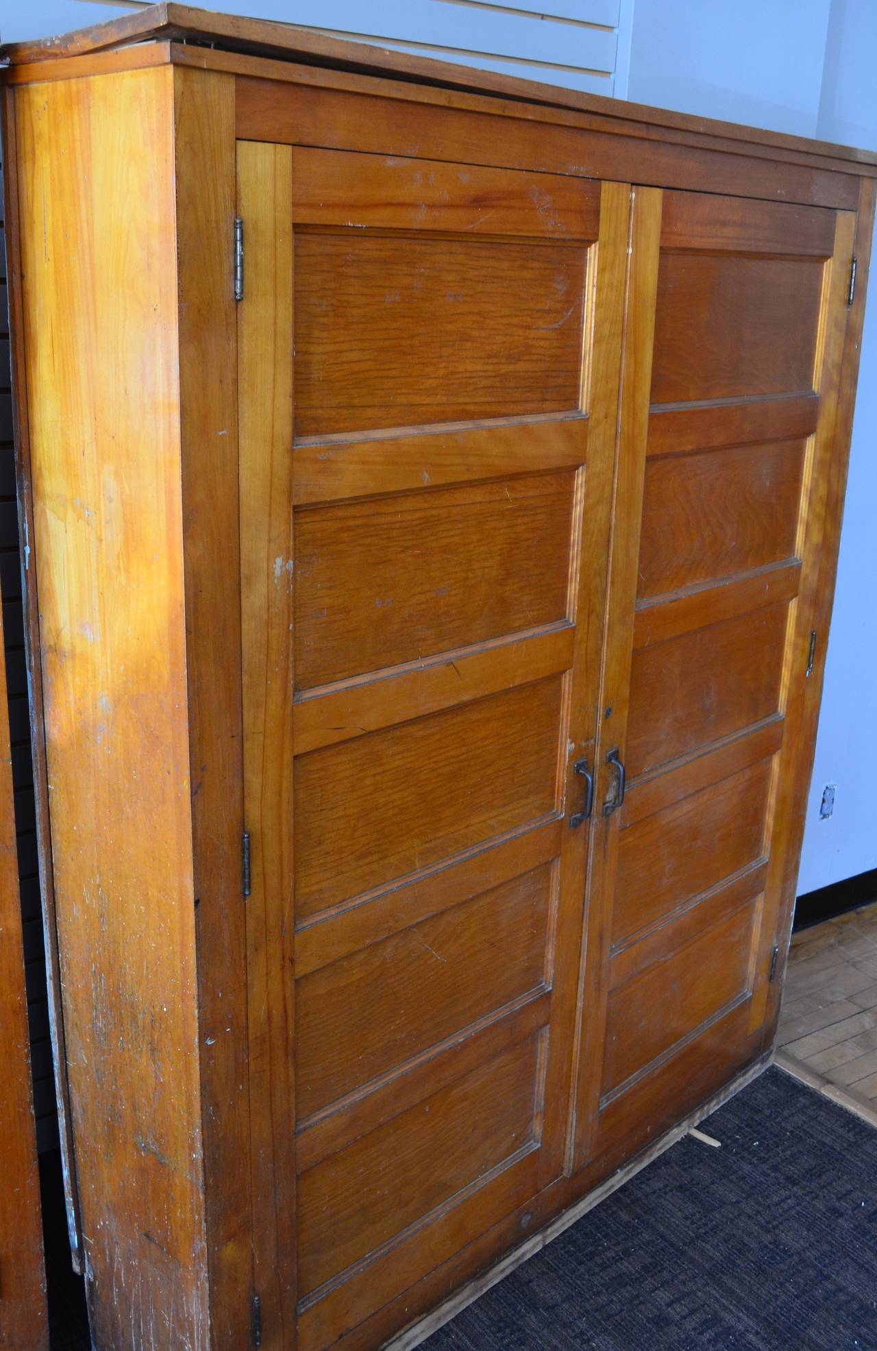 School house pine cabinet locker, circa 1920s. Adjustable shelves within, four shelf boards included. Matching pair available. Priced individually.