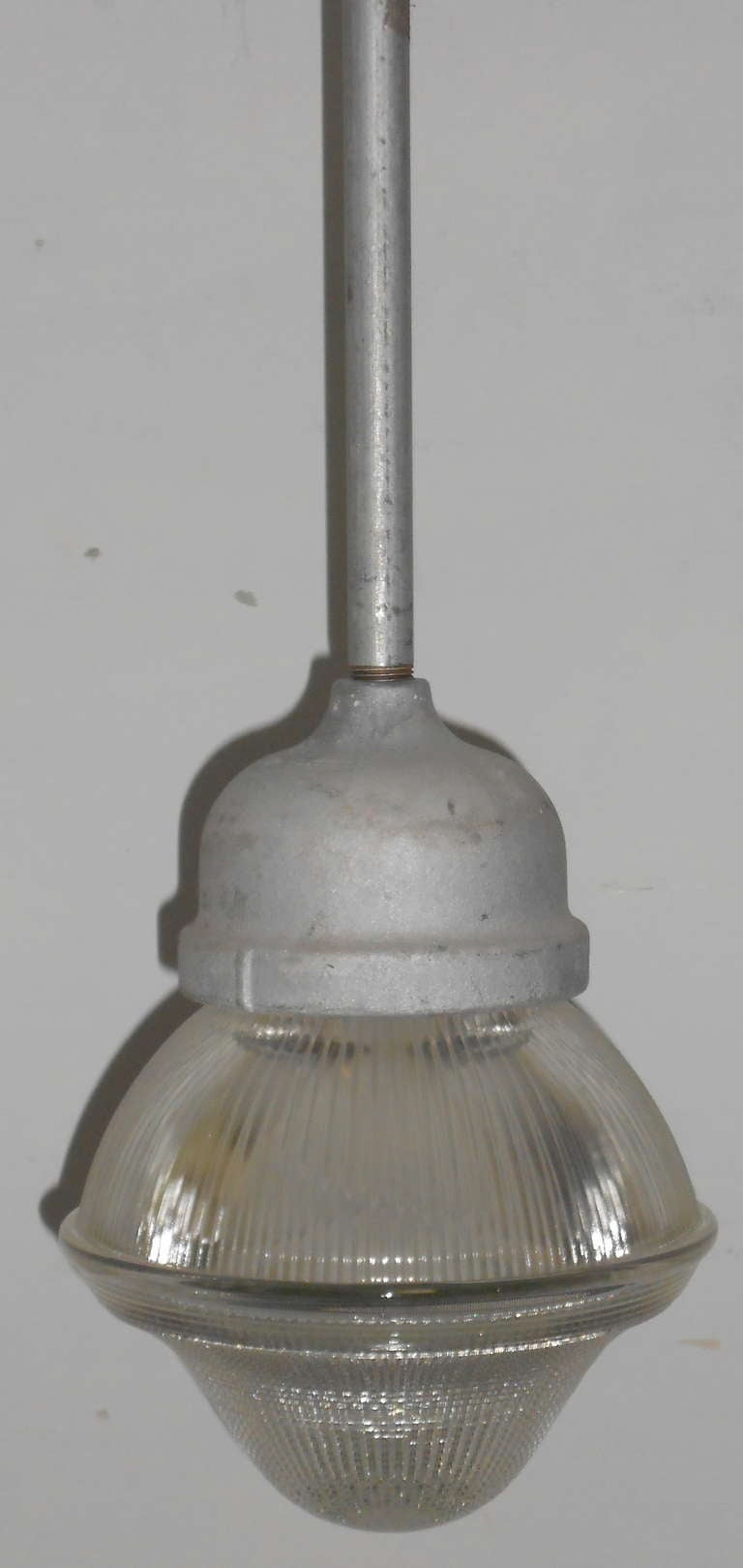Holophane Acorn Light of cut glass casts a beautiful, prismatic glow. In a grouping, they make wonderful pendant lights for over kitchen island and counters. On a dimmer, the range of their illumination is remarkable. Several lights are available,