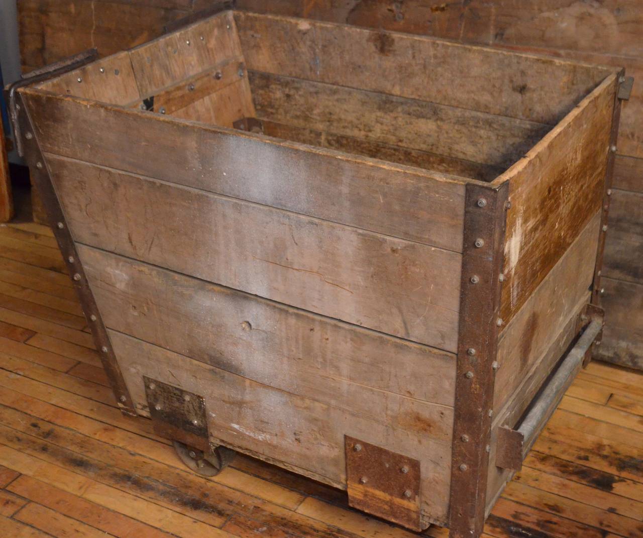 Antique wooden coal cart with removable front panel for shovel access. Mounted on wheels for easy mobility. An ancient beauty from the time that burning coal was the main source of heat for most households. This cart made it easy to wheel in a