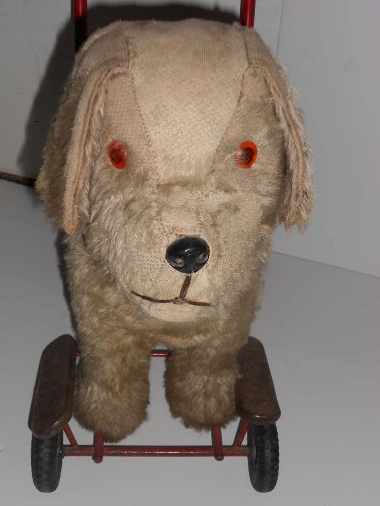 old toy dog on wheels