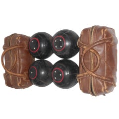 Set of 4 bocce balls with 2 leather carrying cases
