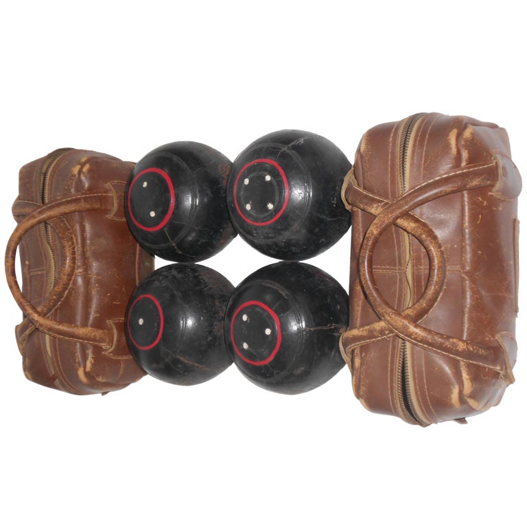 Set of 4 bocce balls with 2 leather carrying cases at 1stDibs