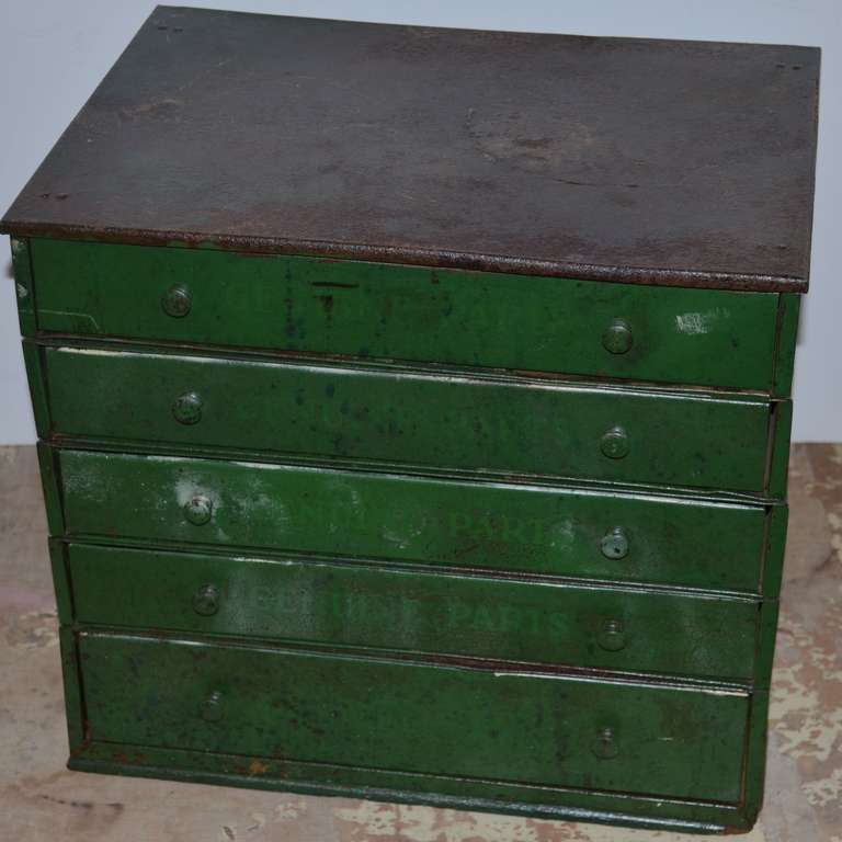Industrial desktop cabinet of painted steel has five stacking drawers with several hundred small compartments of varying sizes from 2.25