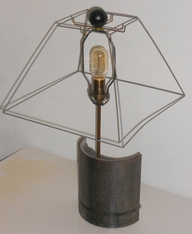 This table lamp has been fashioned from an Industrial cutting tool of grooved steel. Has been wired with UL approved parts and features a 3-way socket, maximum 150 watts. With retro Edison bulb (not included), this lamp projects a striking profile,