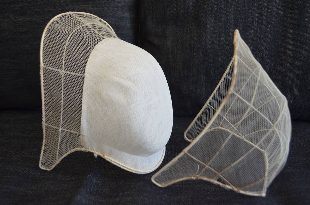 Pair of sewing form templates for Amish prayer bonnet caps. Fragile and delicate, one is with starched white surround, the other comprised of netting alone. As a pair, they capture the quiet purity of prayer and the simple, unadorned lifestyle of