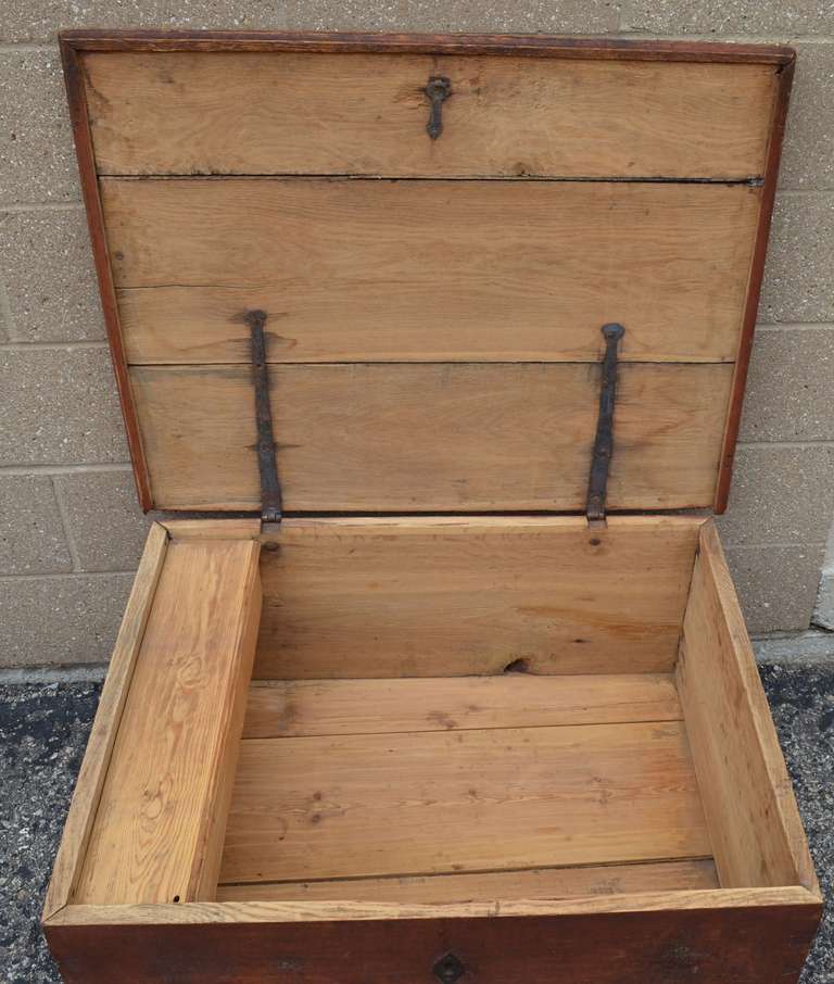 Hand-crafted pine chest/toolbox in desirable near-square shape. Contains lift-out tool compartment inside. Would serve well as coffee table or bedroom chest with dual purpose blanket/bedding storage. Sturdy and solidly constructed with dovetail