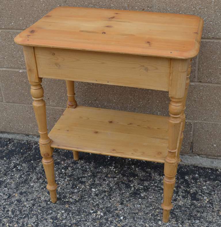 European pine wash stand with two drawers and shelf. Simple yet with nice touches. Highly-functional around the home as end table, hallway table, in the entranceway, beside the bed. Ideal in an apartment or smaller room, affording storage, lamp