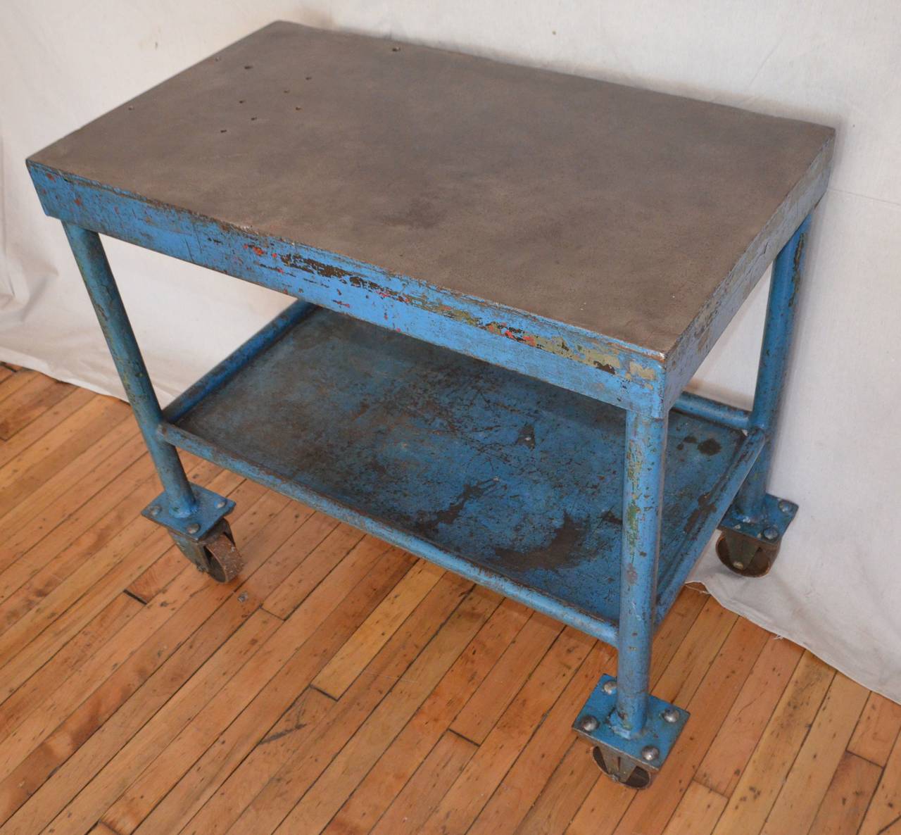 Strength and beautify collide to present a service cart that is as unique as it is functional. As-found, blue-painted steel with two levels for storage and service. On wheels for convenience and ease of movement. Cleaned and sealed to preserve its
