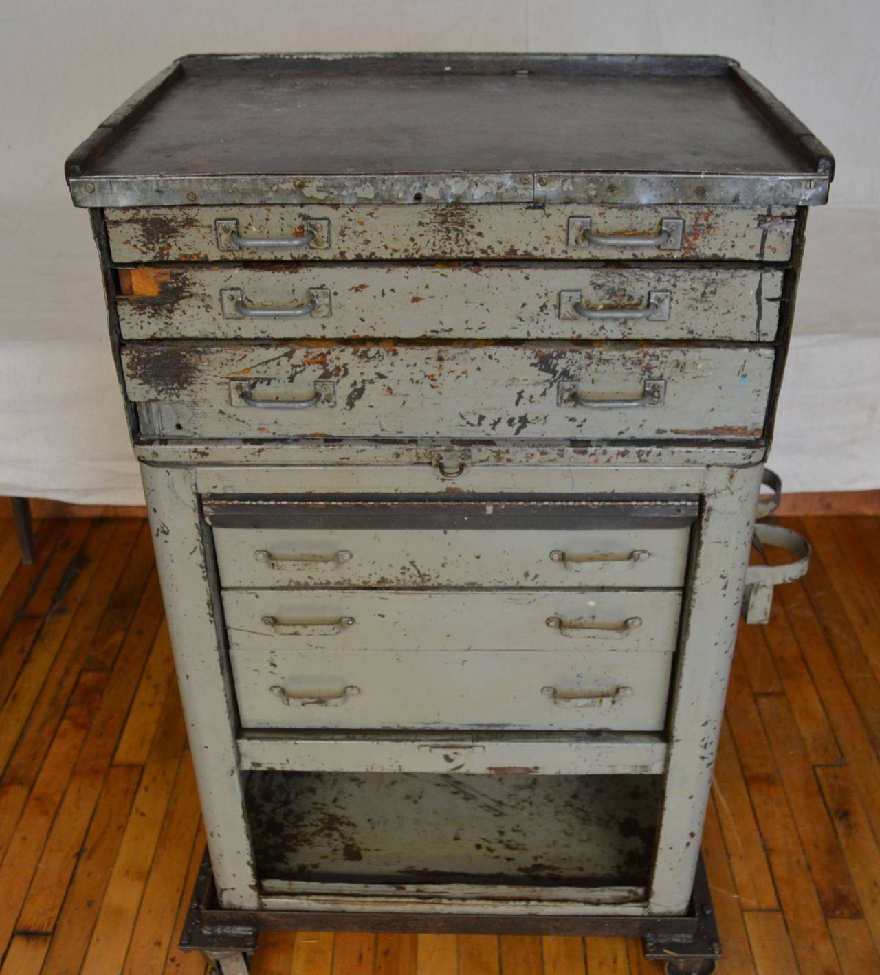 Machinist's tool and storage chest on wheels is actually two separate units that fit together. See bottom photo in sidebar. The top unit is a hard-crafted piece with wide drawers, each compartmentalized to accept a range of tools. The bottom unit is