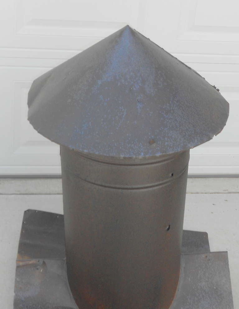 Rusted to perfection, cleaned and sealed, this rocket-ship style,   barn vent cupola makes compelling garden ornamentation, yard sculpture, living room agrarian icon.  While richly patinated with rust, the sheet metal shell is not rusted through and