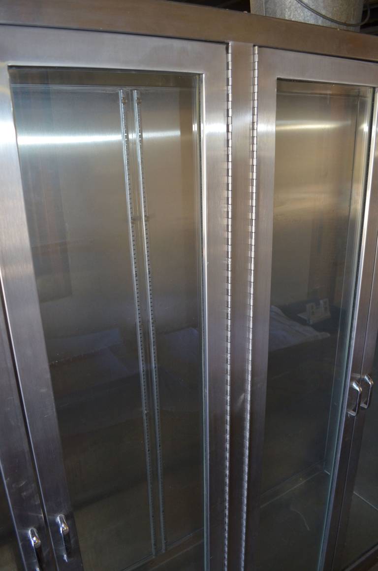 Stainless Steel Medical Cabinet with Full-length Glass Doors and Shelf Brackets In Excellent Condition In Madison, WI