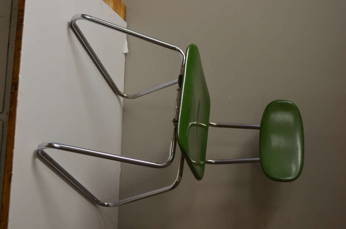 Mid-century modern chairs with stainless steel legs and molded fiberglass seats, sold as set of six. These sturdy chairs display classic mid-century design and function. Simplicity of line, stackable for easy storage, extremely comfortable with