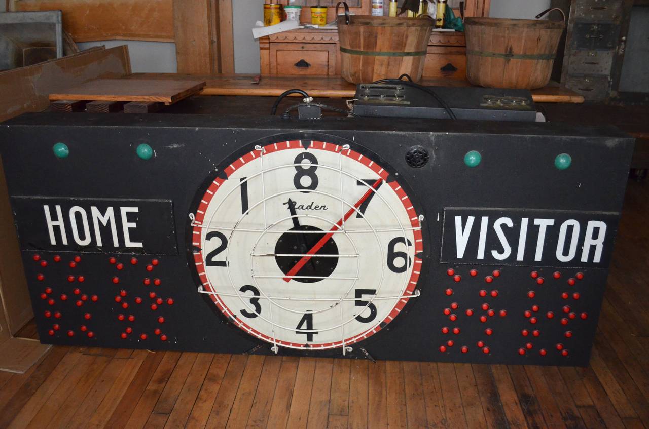Basketball electronic scoreboard in perfect working condition hails from a midwestern Junior High School gymnasium, circa 1950. Standalone control panel changes score, each of the four quarters, even sounds the horn. Clock hands swing through the