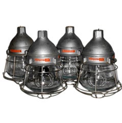 Set of four caged hanging industrial lights