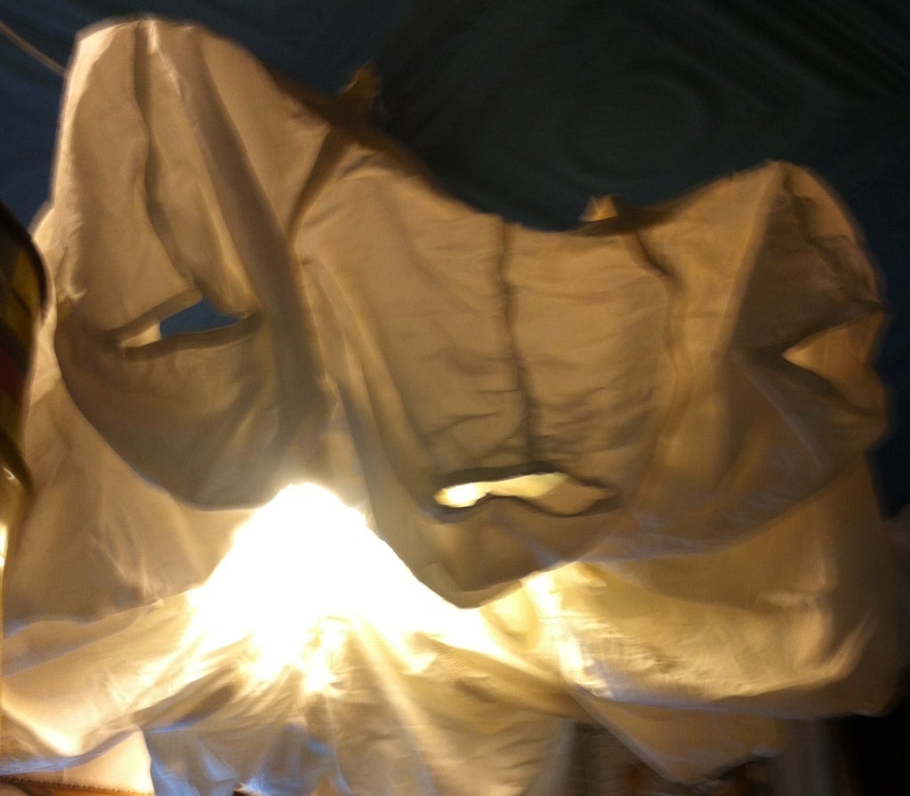 Vintage white parachute serves as large, soft overhead light with great texture, movement and drama. Believed to be circa 1950s. Four available. Could be lit for outdoor application. Size varies depending upon how wide you open for lighting display.