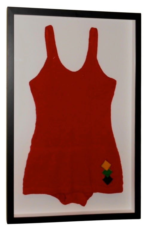 Early 20th century Jantzen swimsuit in shadowbox frame. Vibrant red wool bathing suit framed in black makes striking wall art for beach house, apartment or summer home. Swimsuit measures 17x 29, mounted within 20 x 32 shadowbox.