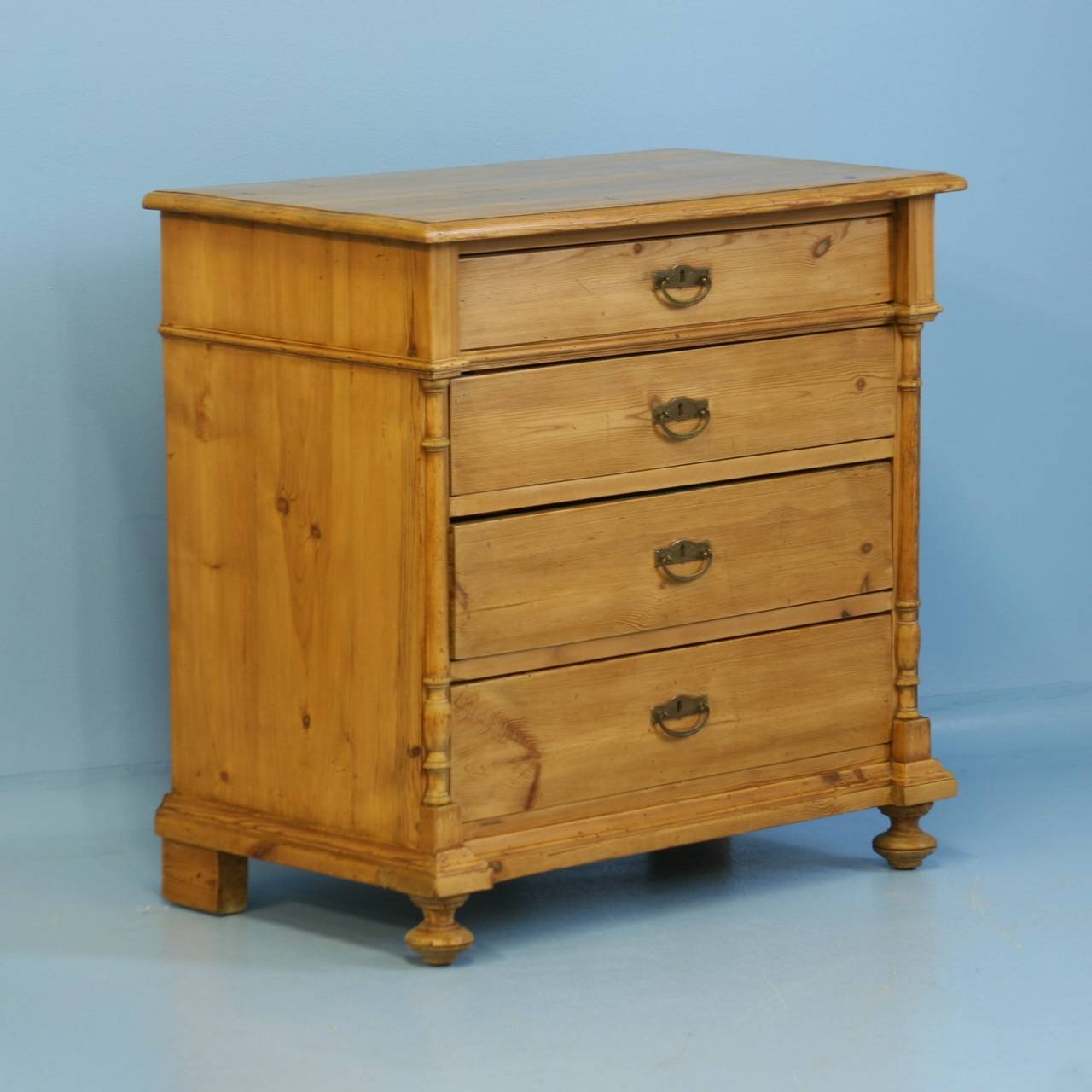 This lovely chest of 4 drawers is from Denmark, circa 1880. The turned column details add a refined touch to its 