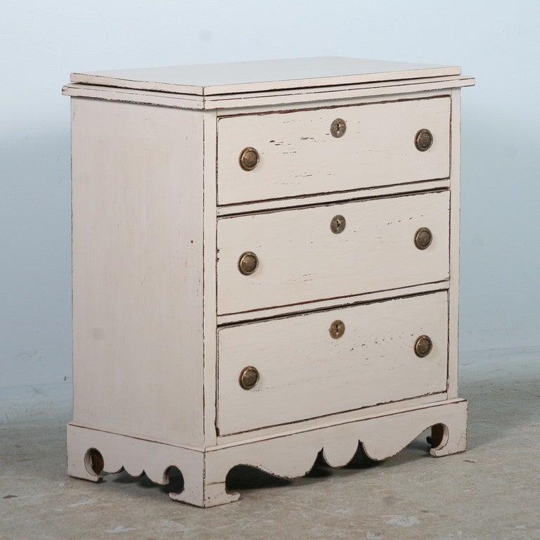 This unique chest of drawers is full of surprises. The top is hinged and opens to reveal a hidden 1