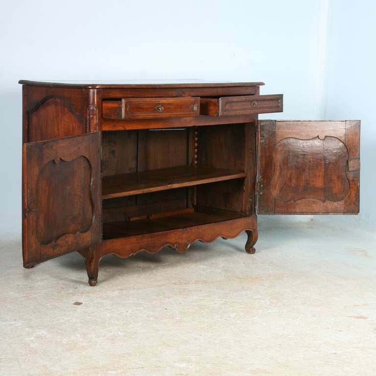 The remarkable beauty of this Louis XV sideboard is a combination of the stunning patina of the wood and the overall craftsmanship. Please examine the close up photos to appreciate the patina and richness of the wood itself. Note the graceful lines