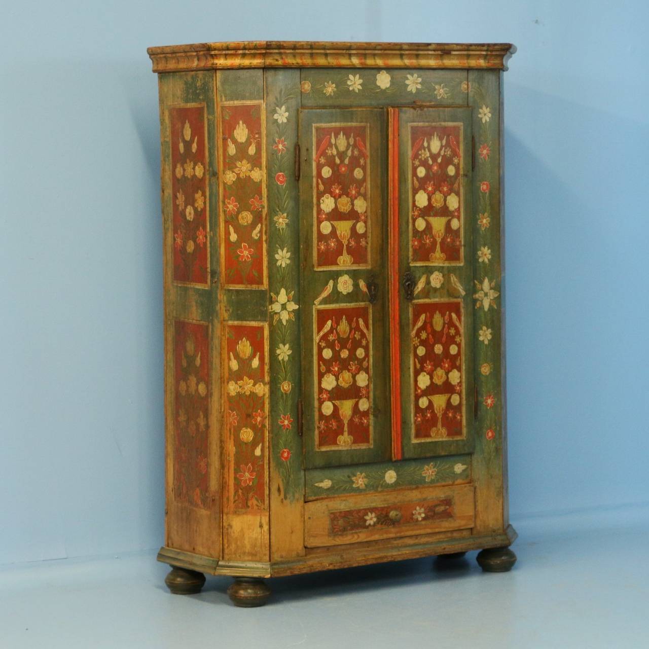 This is a truly outstanding painted armoire due to the high quality and detail of the original paint.  The soft, gentle colors with delightful bird and floral motif are unusual in both detail and quality. Please examine the close up photos to