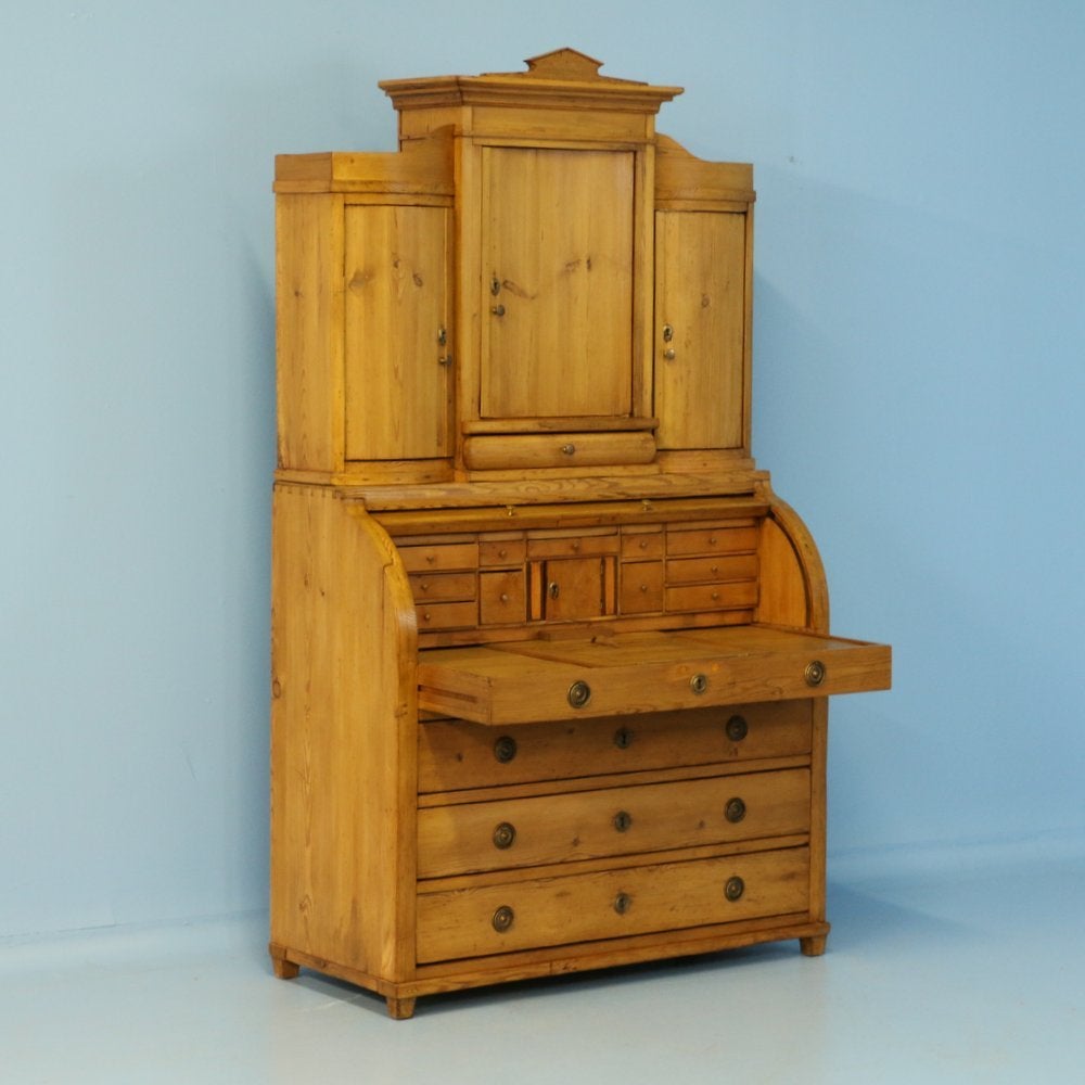 This truly lovely secretaire becomes a showcase thanks to the beauty of the natural pine, waxed to bring out the warmth of the wood. There are countless drawers for organization, including a hidden compartment which was often a design element in