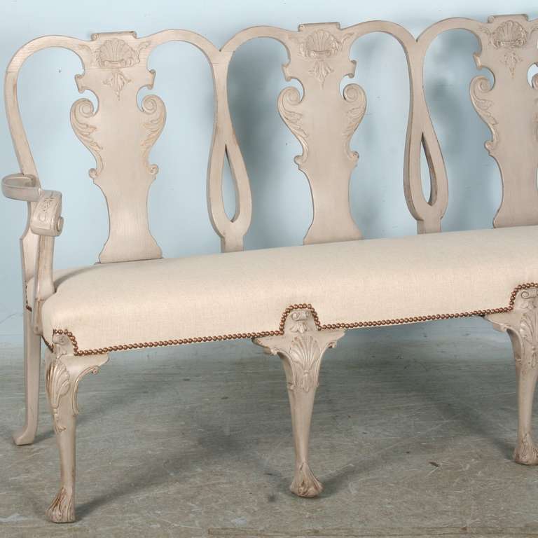 This graceful bench or settee has recently been given a new painted finish, creating a Gustavian look and feel. It has also been upholstered in a fresh, clean linen and is ready for immediate use. At the back, the width is 63