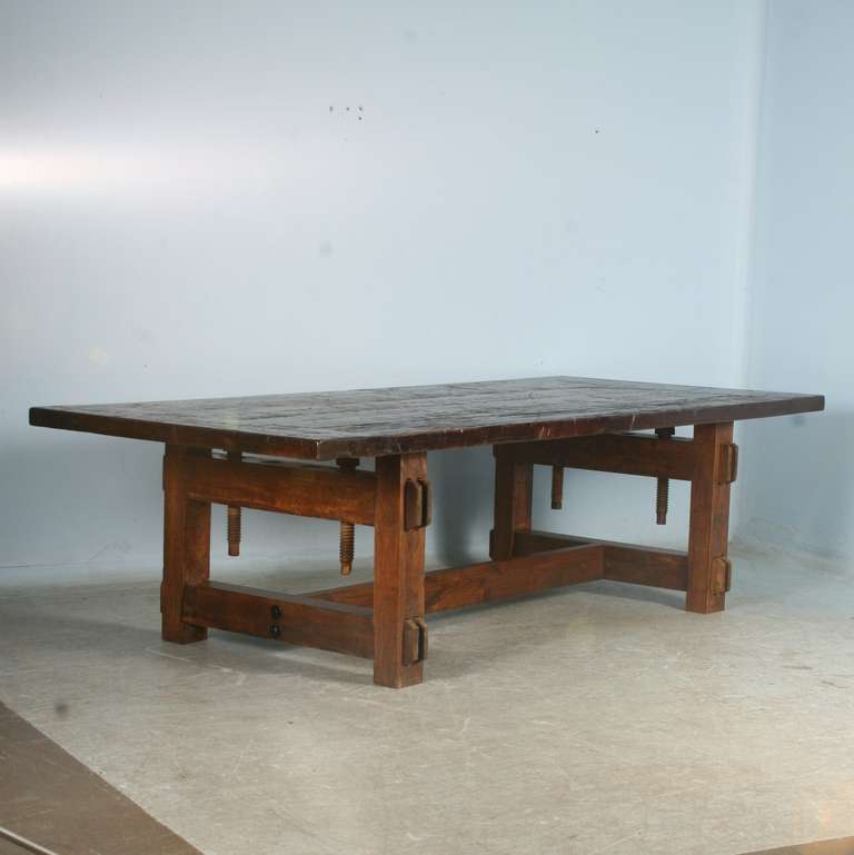 This amazing 9' table has a strong architectural look, thanks to the 
 base which is an old vice (circa 1900's). the top has an industrial feel; it is made from reclaimed railroad cart wood (circa 1900's). This large dining or conference table has