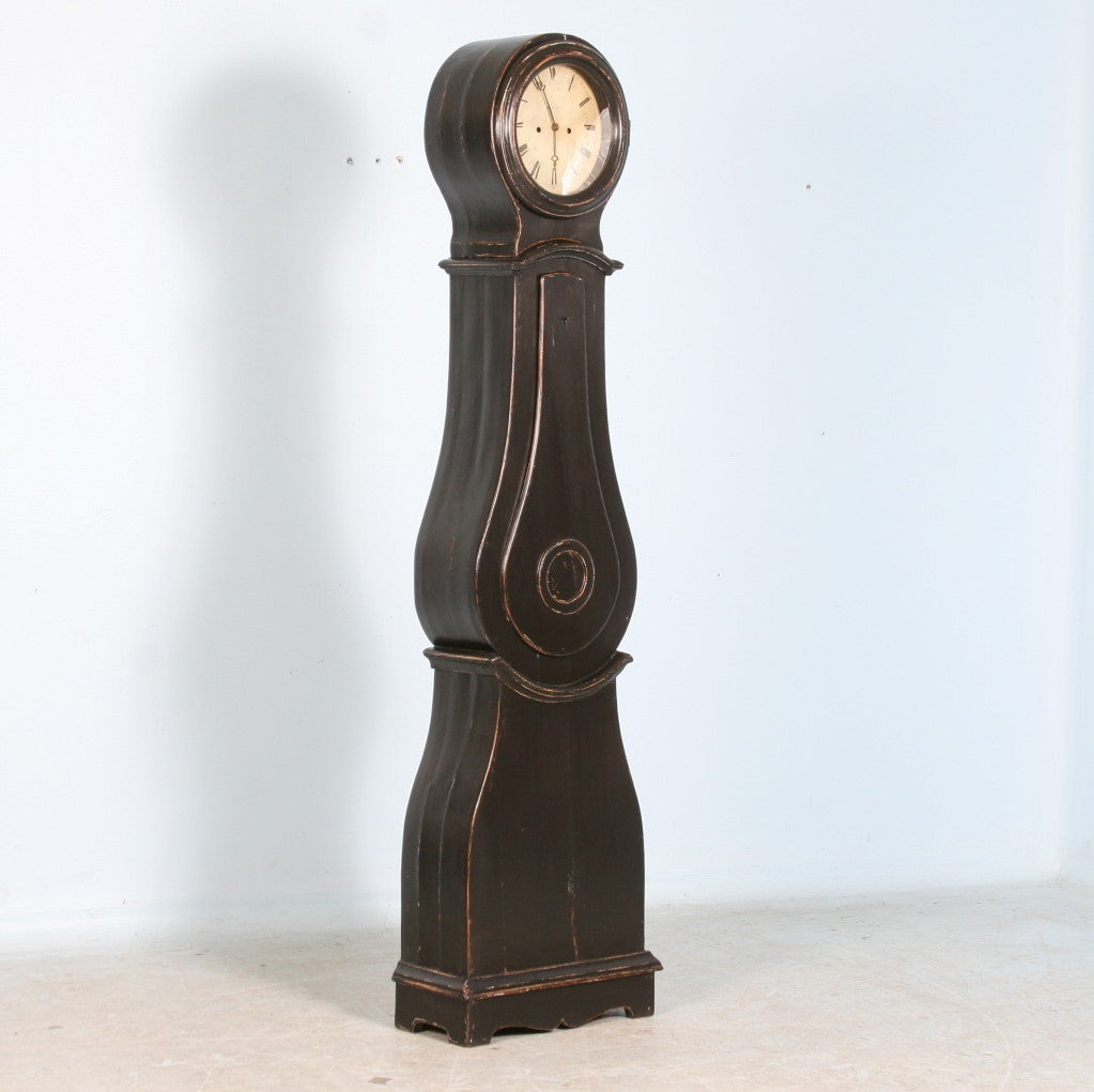 Antique Swedish Black Painted Grandfather Clock. The lovely curves of this clock are typical of the Mora grandfather clocks, famous from Sweden. The clock will work/function before leaving our store. Original clockworks may be restored, or for ease