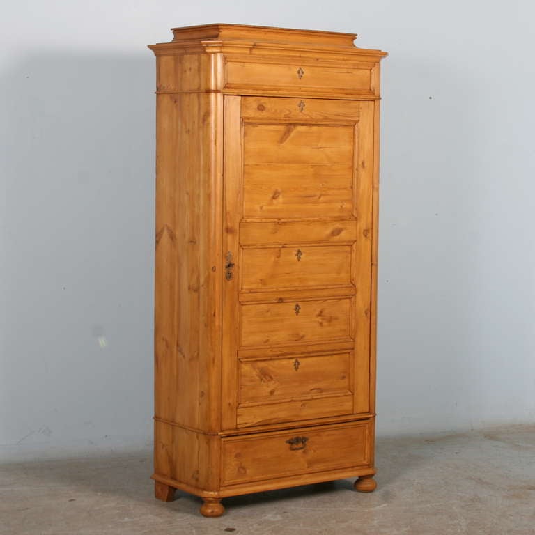 Beautiful clean lines and warm waxed pine are the hallmarks of this lovely armoire. Known as a 