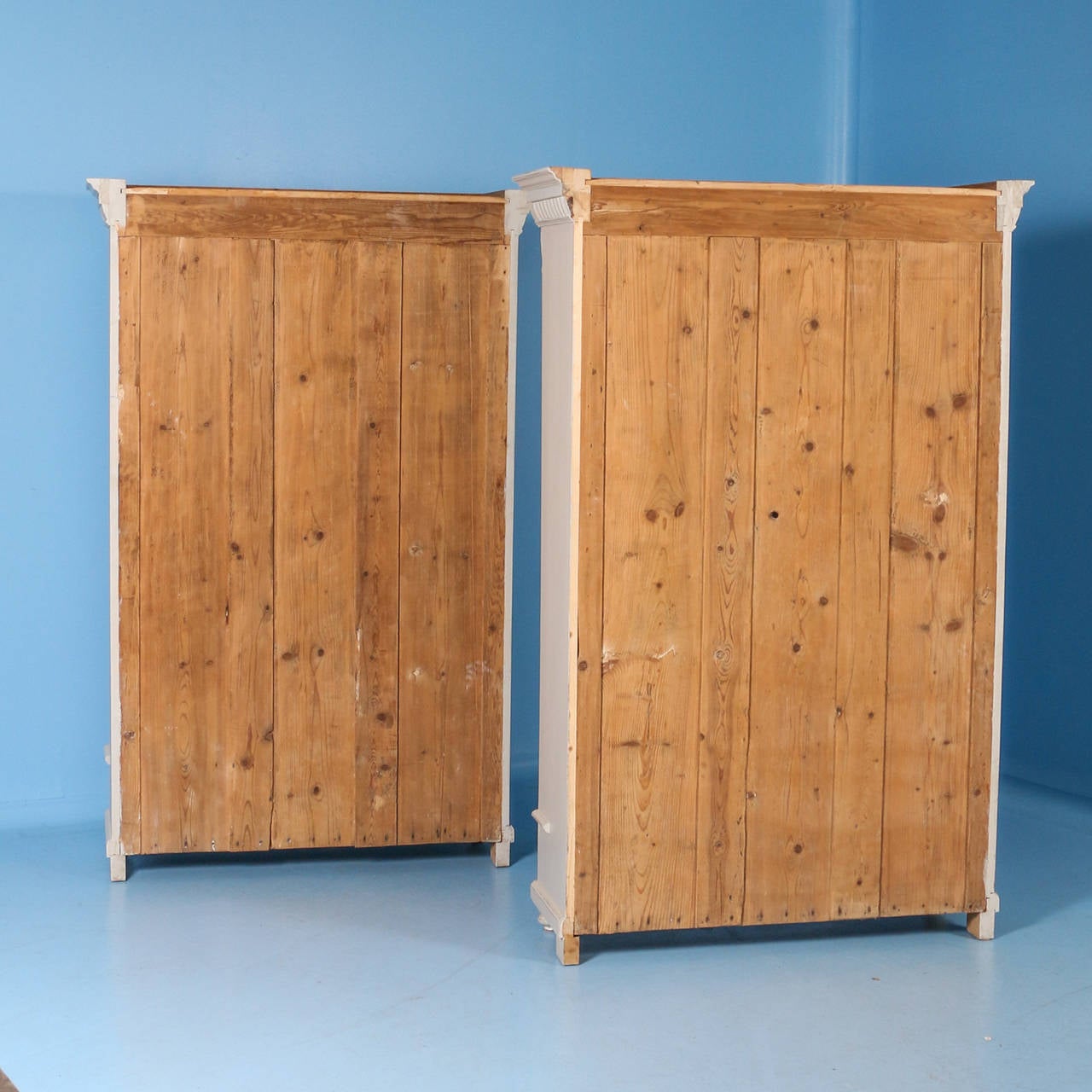 This unique pair of matching bookcases are from the late 1800s in Sweden. The soft dove gray outer paint and interior blue paint were recently added, fitting the Gustavian look of these lovely old bookcases. Adjustable shelves make it easy to create