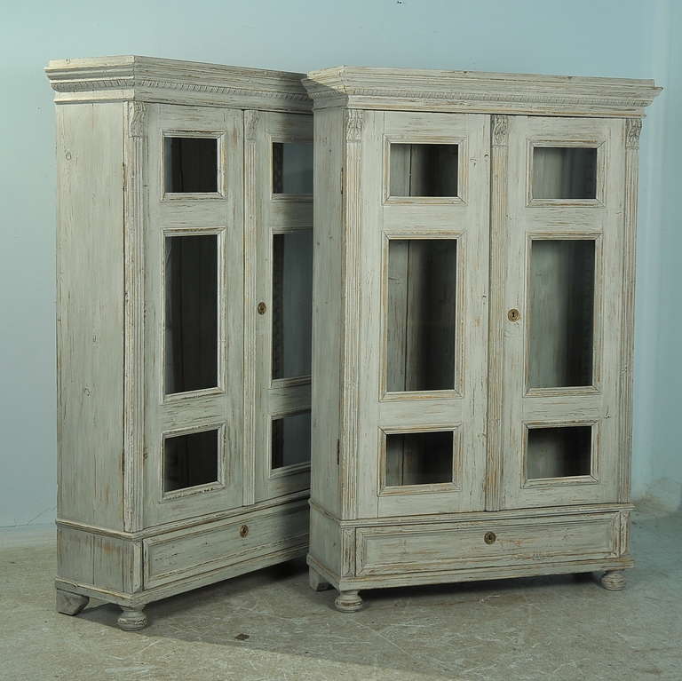 This pair of classic Swedish matching bookcases have an adjustable shelving system making them ideal for display. The lovely Gustavian grey paint is new, giving a soft, fresh appeal to the pair. The painted finish is perfectly distressed to fit with