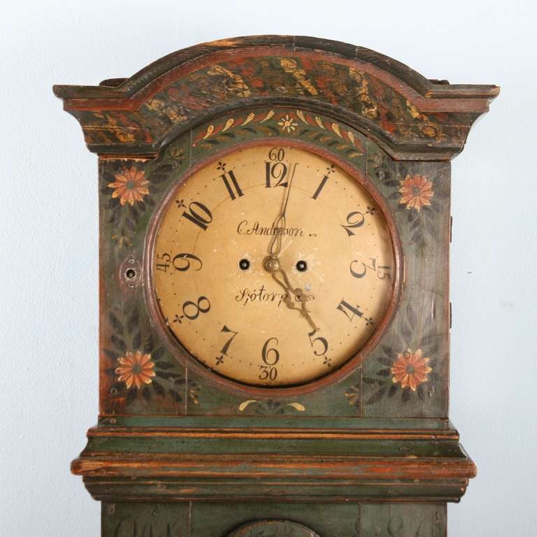 This tall grandfather clock is in superb original condition. The paint has been preserved amazingly well; it is rare to have this authentic original paint. There are two sets of monograms the the left and right of the door, with the date of 1822