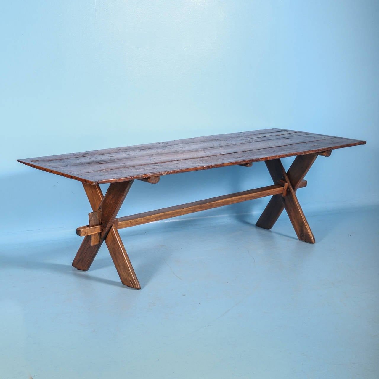 Country pine plank table from Sweden. Loaded with warmth and charm, this table will be perfect for an informal dining setting. 

Scandinavian Antiques imports containers from Europe throughout the year. At best, only 10% of our large inventory is