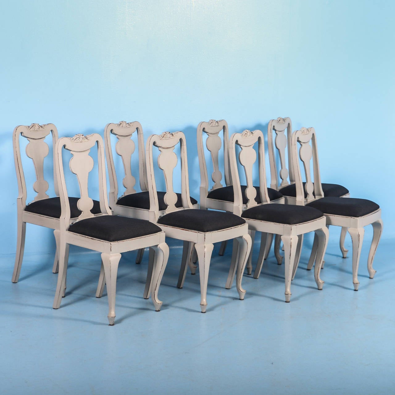 Antique Swedish dining chair set of ten chairs. This large set of dining chairs includes eight side chairs and two arm chairs. They have recently been given a gray painted finish, which compliments the Swedish style and era. Please examine the close