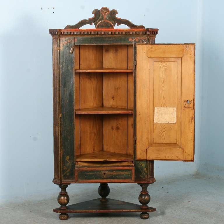 The paint, date and monogram are all original on this charming corner cabinet cupboard. On the inside door is a hand-written note (unfortunately we do not have the translation), making one wonder of the family who first owned it. The decorative