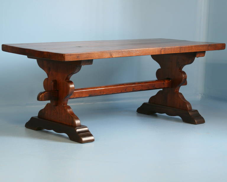 This French Farmhouse Trestle Table is made of oak which has a soft luster that makes the wood seem to glow. The base which hold the trestle stretcher has many curves, adding a romantic touch to the table. Table is very solid and ready for use.