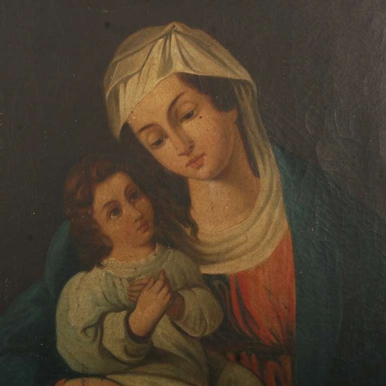 This lovely oil painting was purchased in Budapest, Hungary. While the artist is unknown, there is a soft, simplistic ethereal quality about the Madonna and Child. The painting still maintains its original finish and has not been re-touched. The