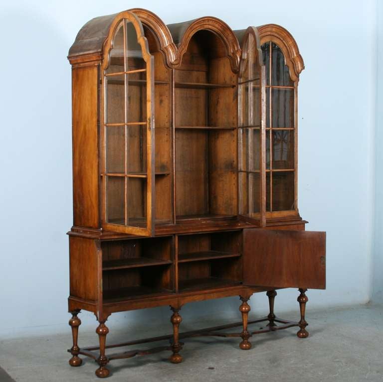 Rare William and Mary china cabinet. Note the close up detailed photos of the stunning wood, turned legs and feet, and impeccable finish. The piece is made of Walnut.