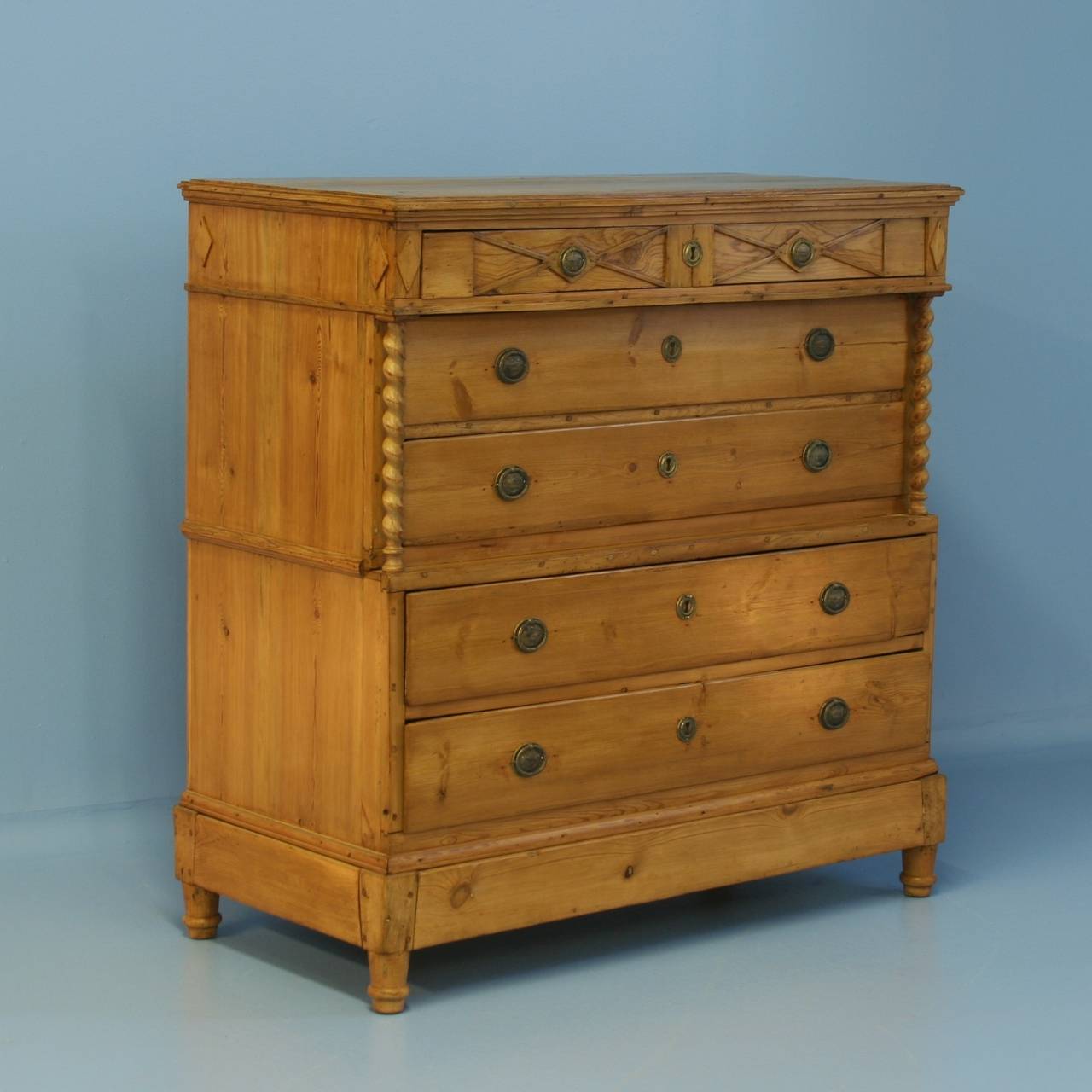 This large chest of drawers is striking due to the many design elements blended beautifully here. The barley twist columns accent 2 recessed drawers. Carved diamonds and details on the top drawer brings attention to the upper section. Overall, this