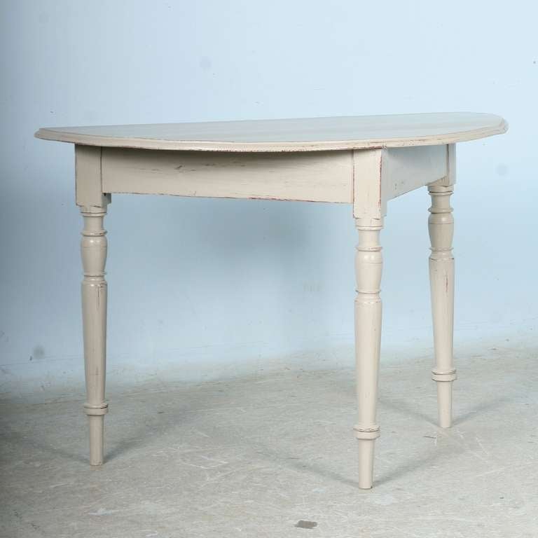 Original antique demi-lune table has been given a new, Gustavian style paint adding to its Swedish country appeal.