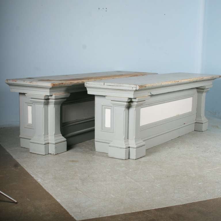 These shop counters likely served in a Colorado newspaper office in the 1800's. They still have a gray painted finish, but can be stripped back to the natural wood if desired. Either of these will make an exceptional kitchen island, and can be