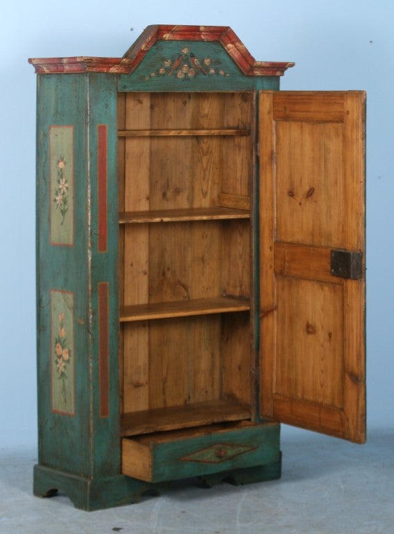 This armoire displays exceptional German styling of the period and is monogramed/dated 
