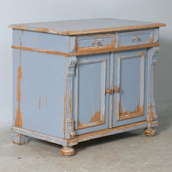 Old distressed blue paint with waxed finish; cool vintage look. Could be used as a fun vanity with sink or as a nightstand alongside a twin or queen size bed.