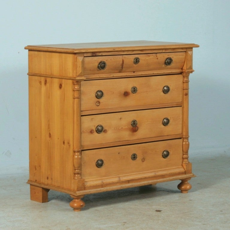 This dresser is accented with half column details and a gently curved top drawer.  The Danish pine has been given a natural waxed finish, bringing out the warmth in the wood. While this superb piece makes an obvious dresser,it may also serve as an