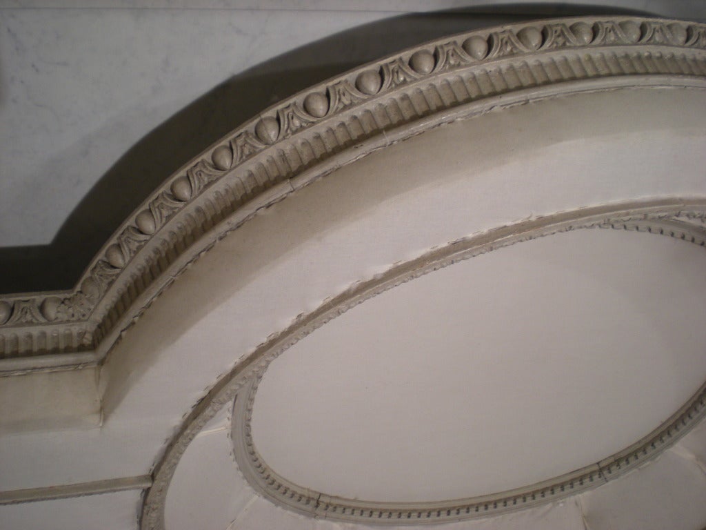 Carved and painted wood canopy with muslin fabric