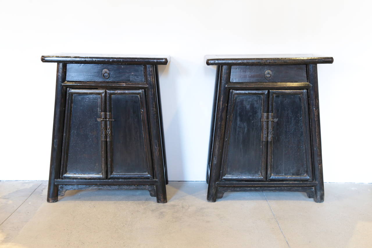 Pair of 19th century Chinese Tapered Cabinets.  Bedside tables, night stands, or side tables.  Very functional having an upper drawer and lower cabinet with shelf.  Extremely strong and sturdy, having hardwood construction.
Very good condition,