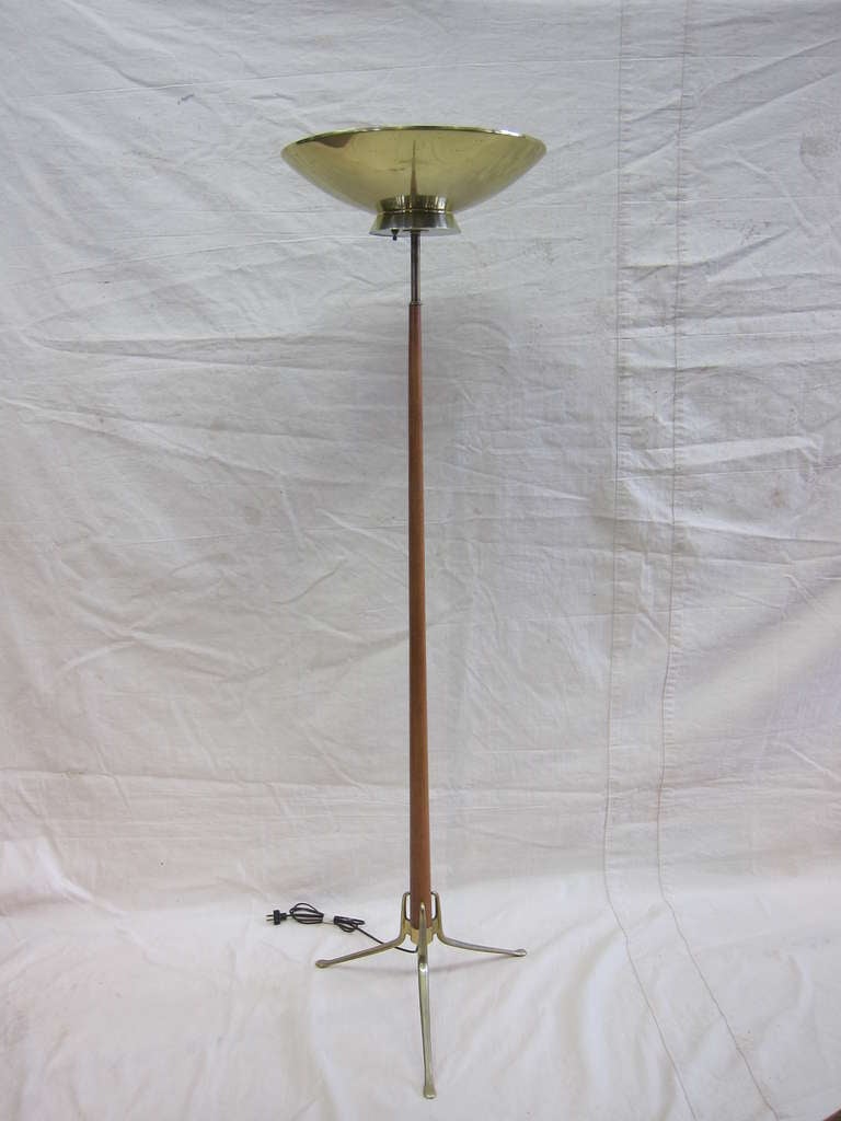 A Gerald Thurston three leg dome floor lamp in very good original condition. 
Brass-plated dome shade, wooden pole, with brass legs. All original in very good condition.